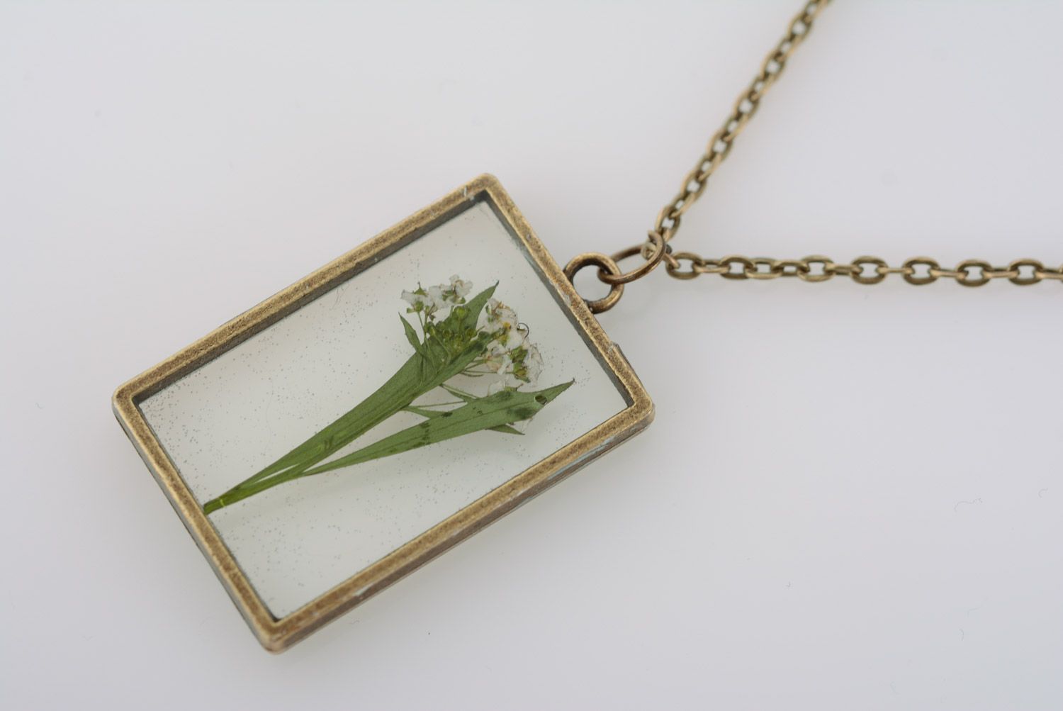 Handmade designer botanical pendant with real flower coated with epoxy and equipped with long chain photo 4