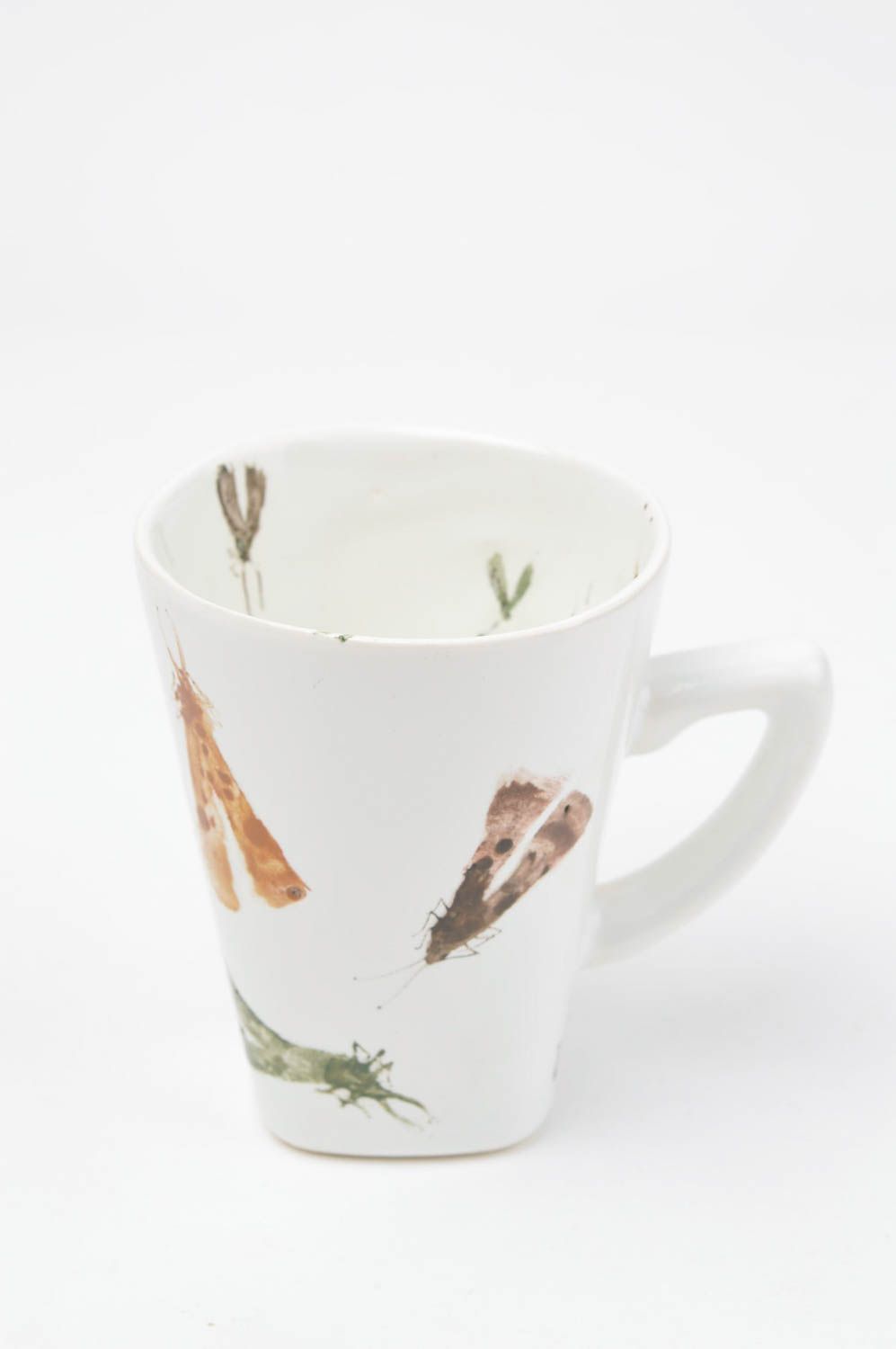 White ceramic teacup with handle and insects prints photo 2
