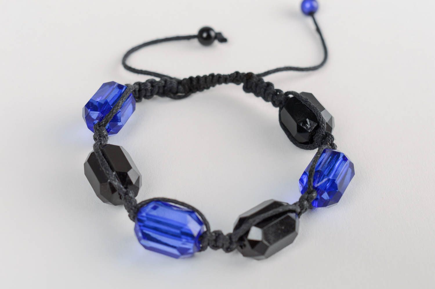 Homemade festive bracelet made of large plastic beads using macrame technique photo 1