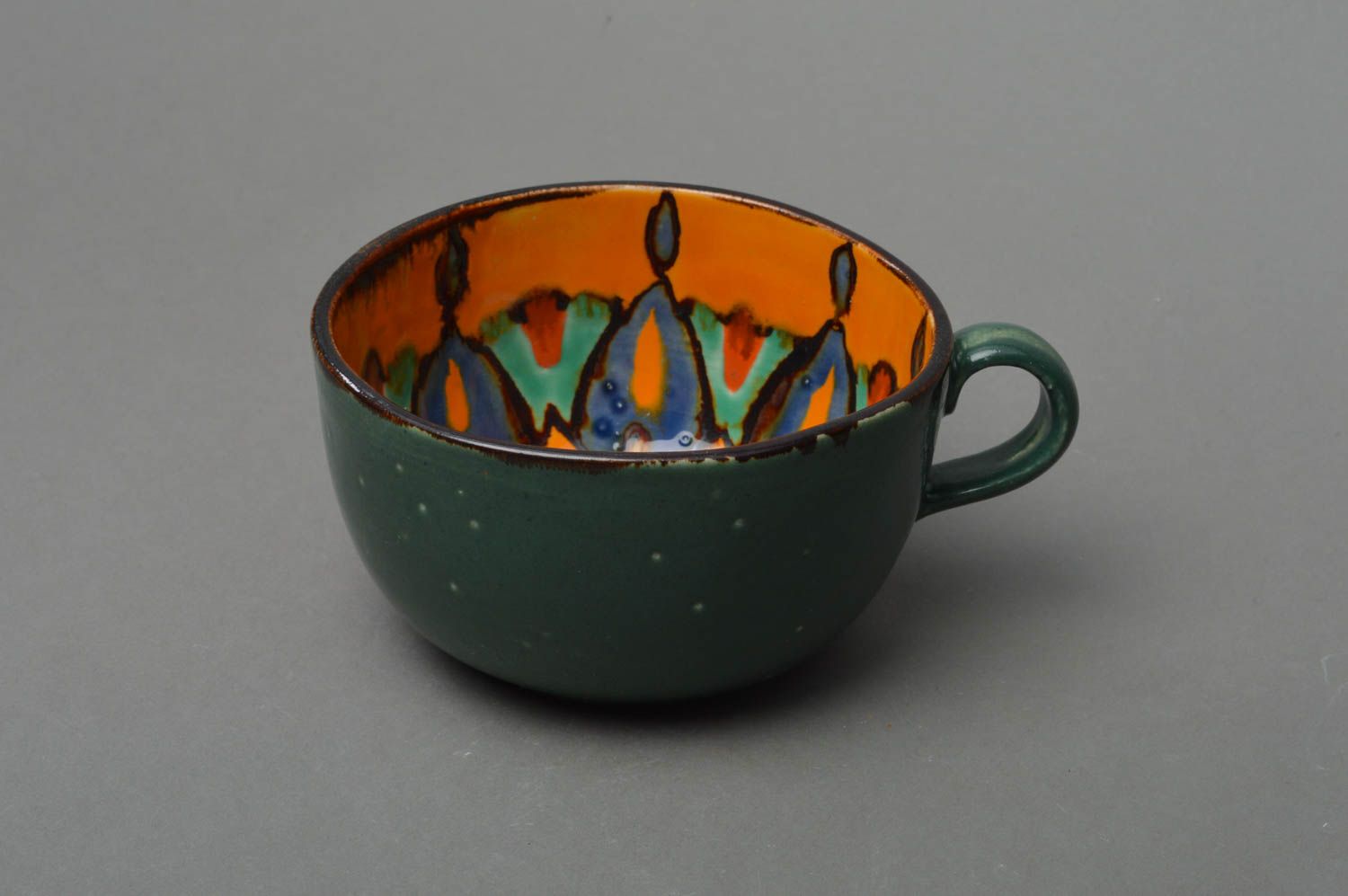 Small porcelain tea dark green cup with colored patterns inside photo 1