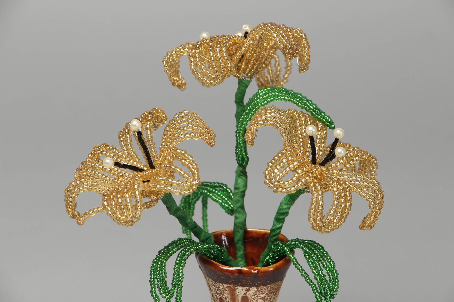 Elegant beaded lilies of gold color photo 2