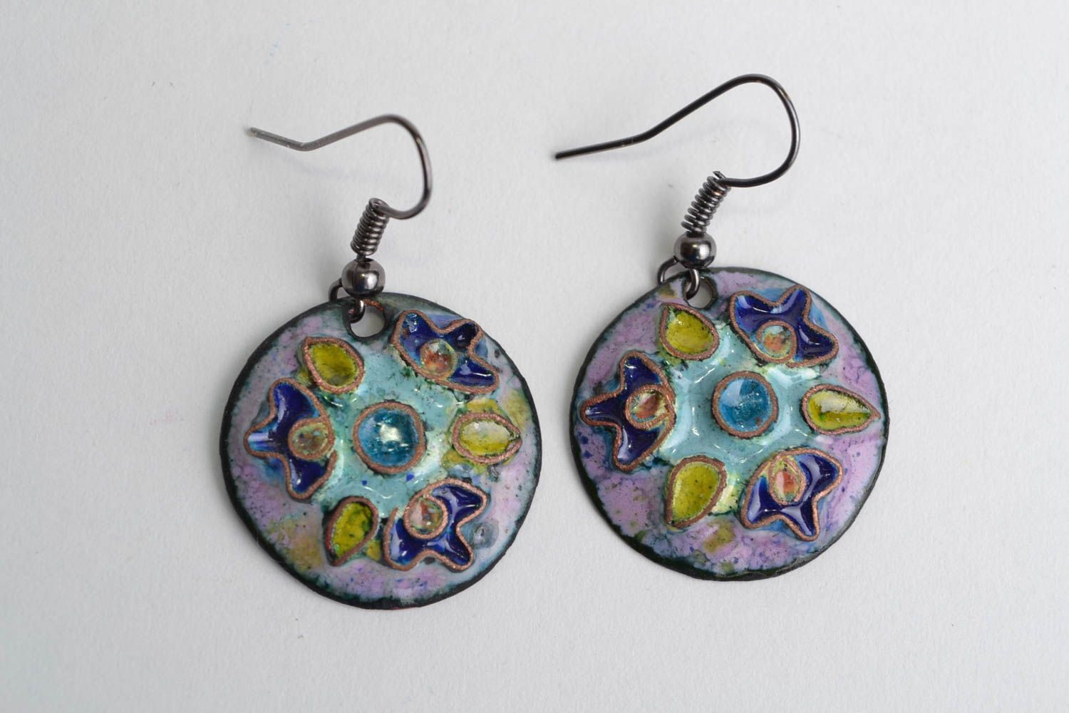 Handmade round shaped enameled copper dangling earrings in blue color palette photo 1