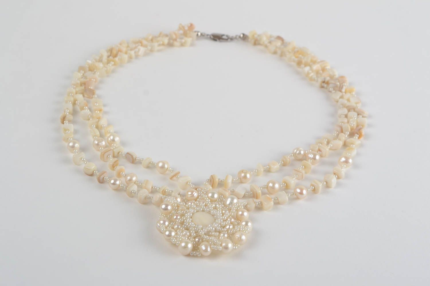 Beautiful gentle handmade necklace woven of beads and natural stone photo 2