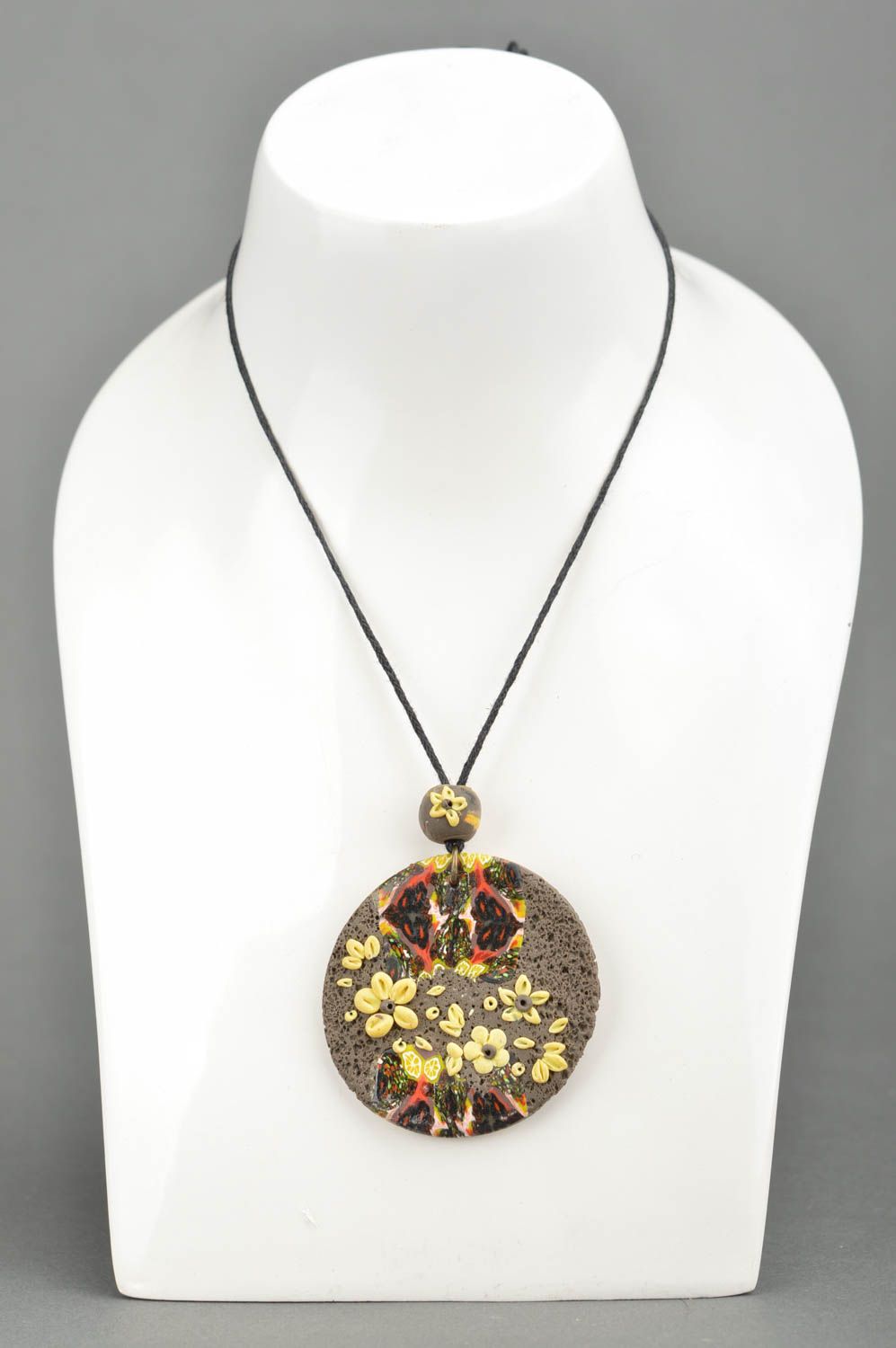 Handmade round grey pendant made of polymer clay decorated with yellow flowers photo 5
