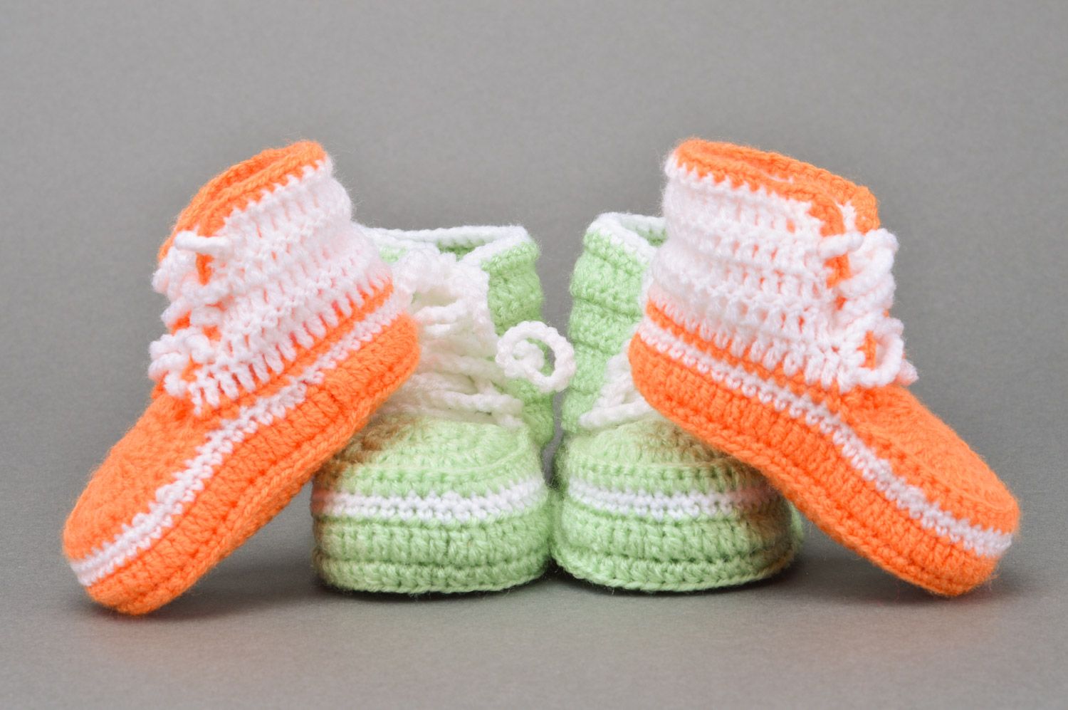 A set of handmade crocheted baby booties two pairs of light green and orange colors photo 5