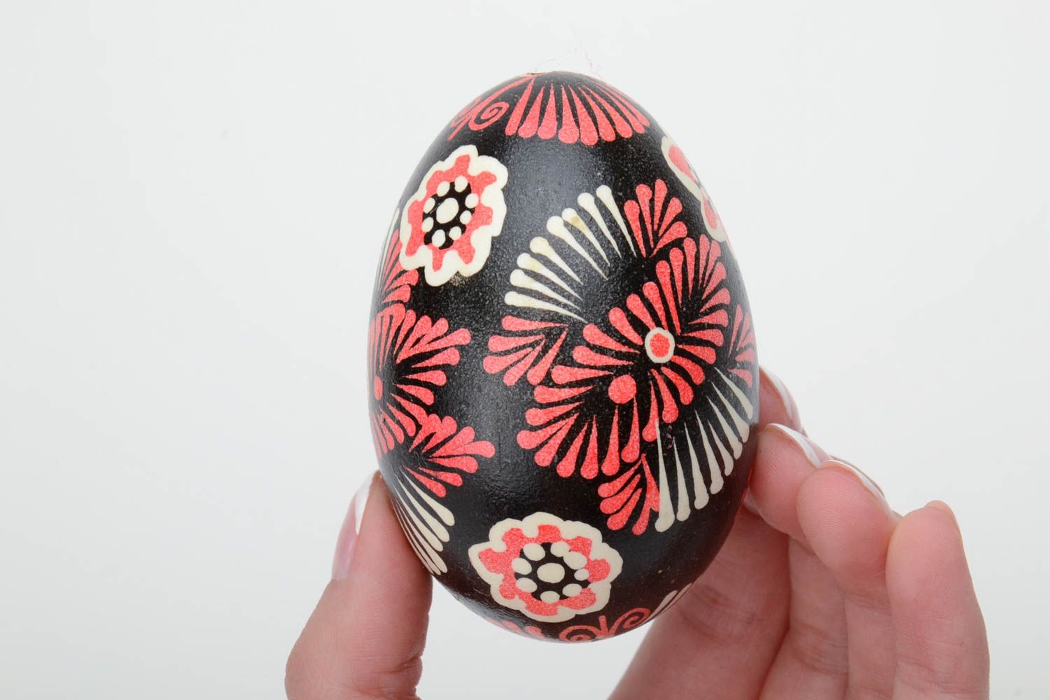 Handmade decorative painted Easter egg with ornament on black background photo 5