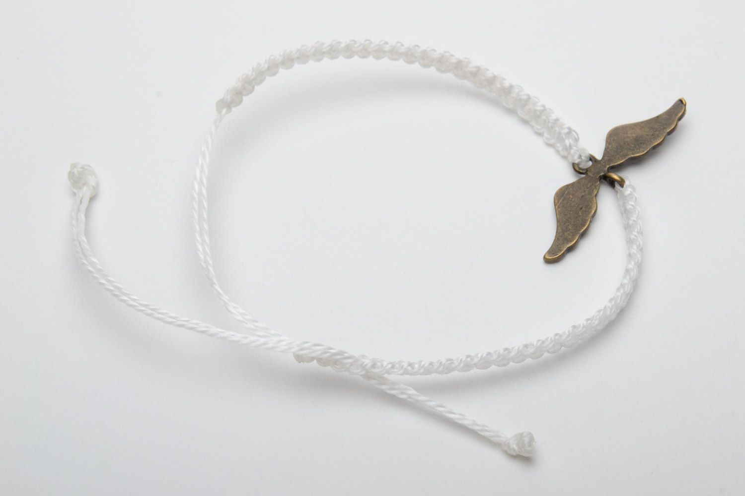 Handmade white women's woven thread bracelet with metal charm photo 4