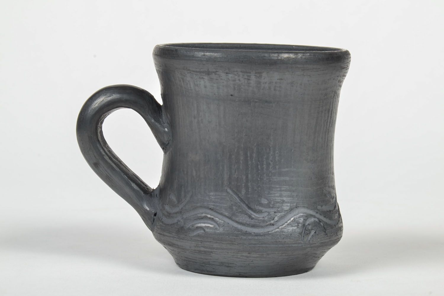 Black-smoked ceramic cup in rustic style with handle and no pattern photo 2