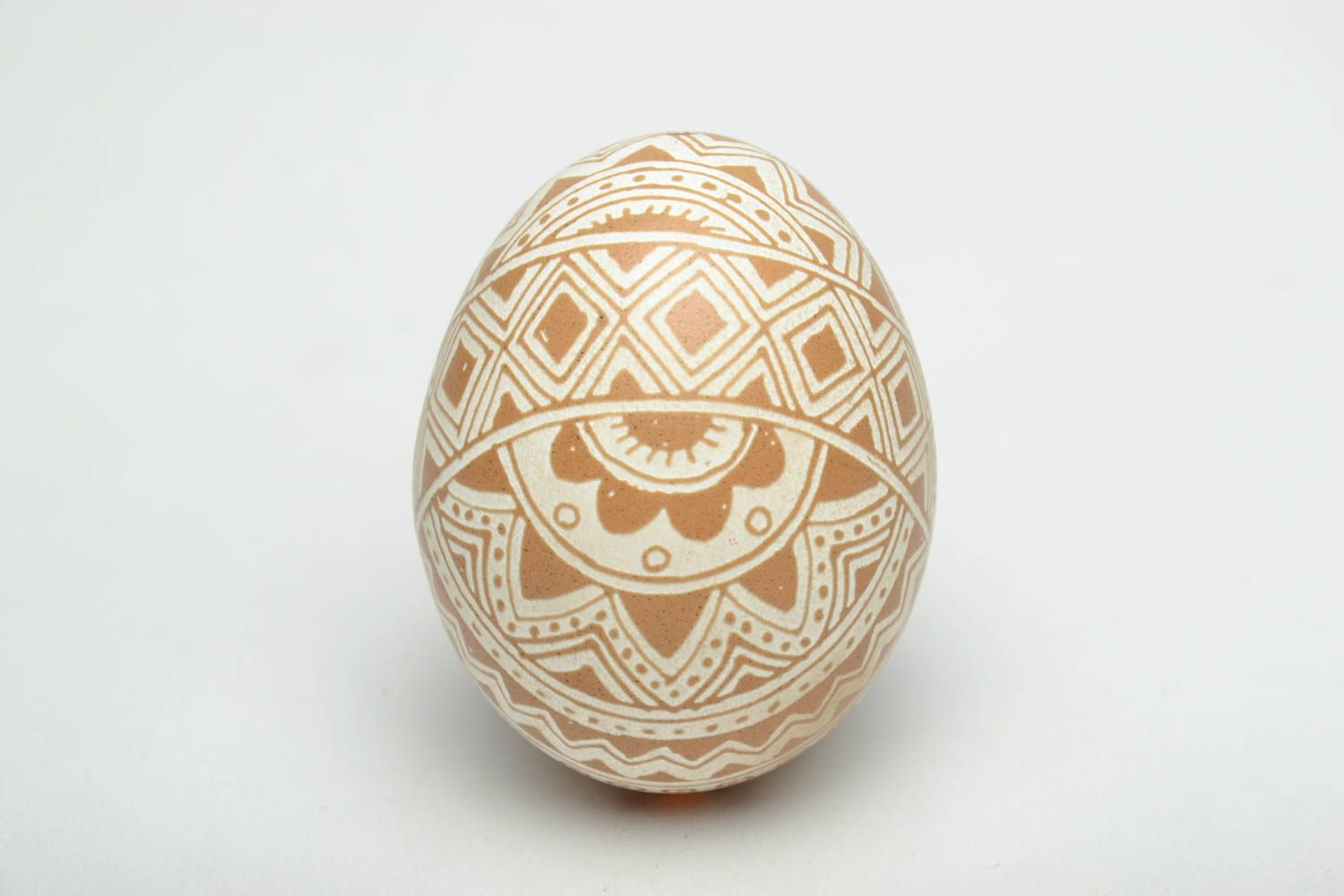 Easter egg with traditional Ukrainian symbolics made using vinegar etching technique photo 2