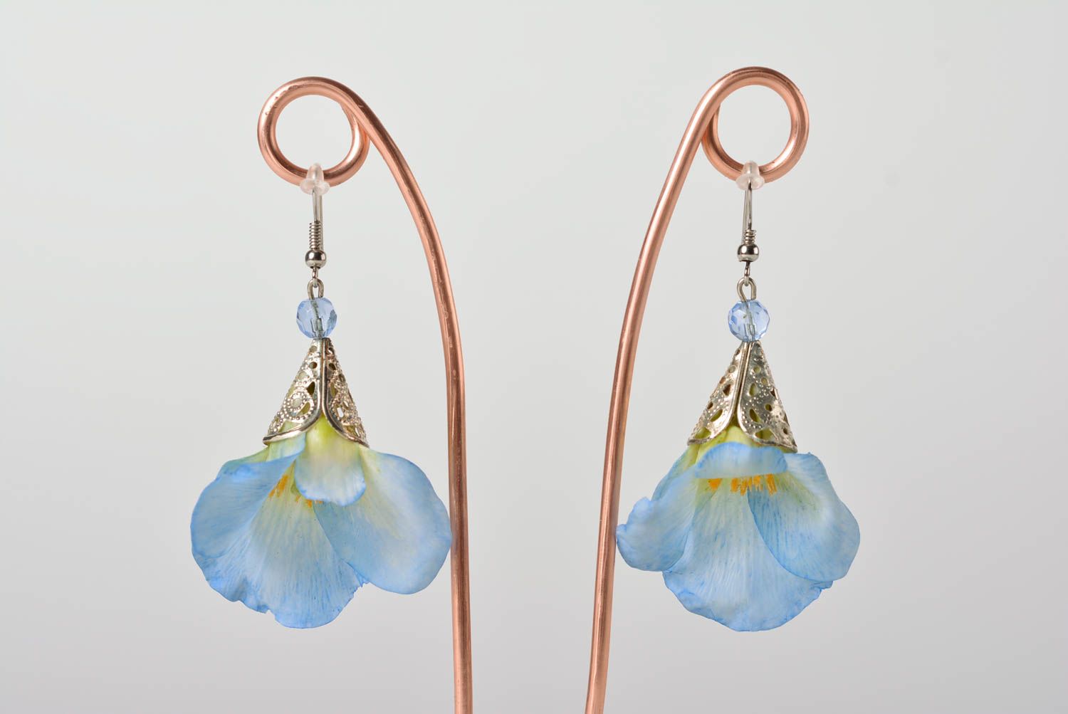 Homemade designer dangling earrings with blue flowers molded of polymer clay photo 1