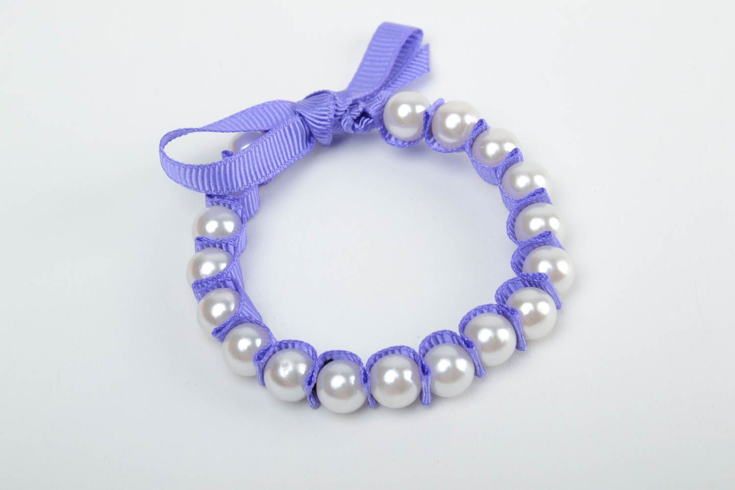 Handmade thin wrist bracelet with plastic pearl like beads and violet rep ribbon photo 4