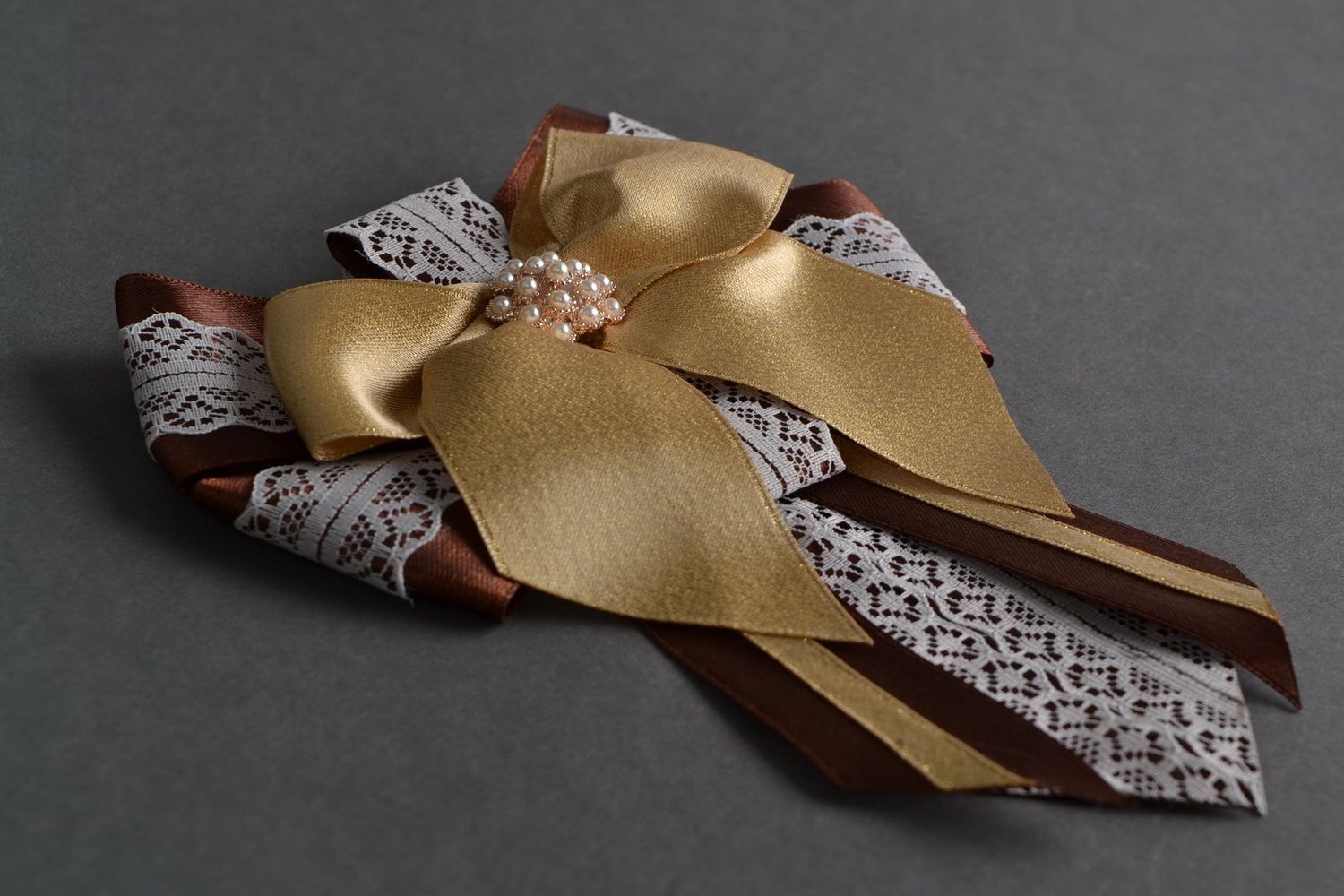 Handmade designer satin ribbon brooch in the shape of bow in brown color palette photo 1