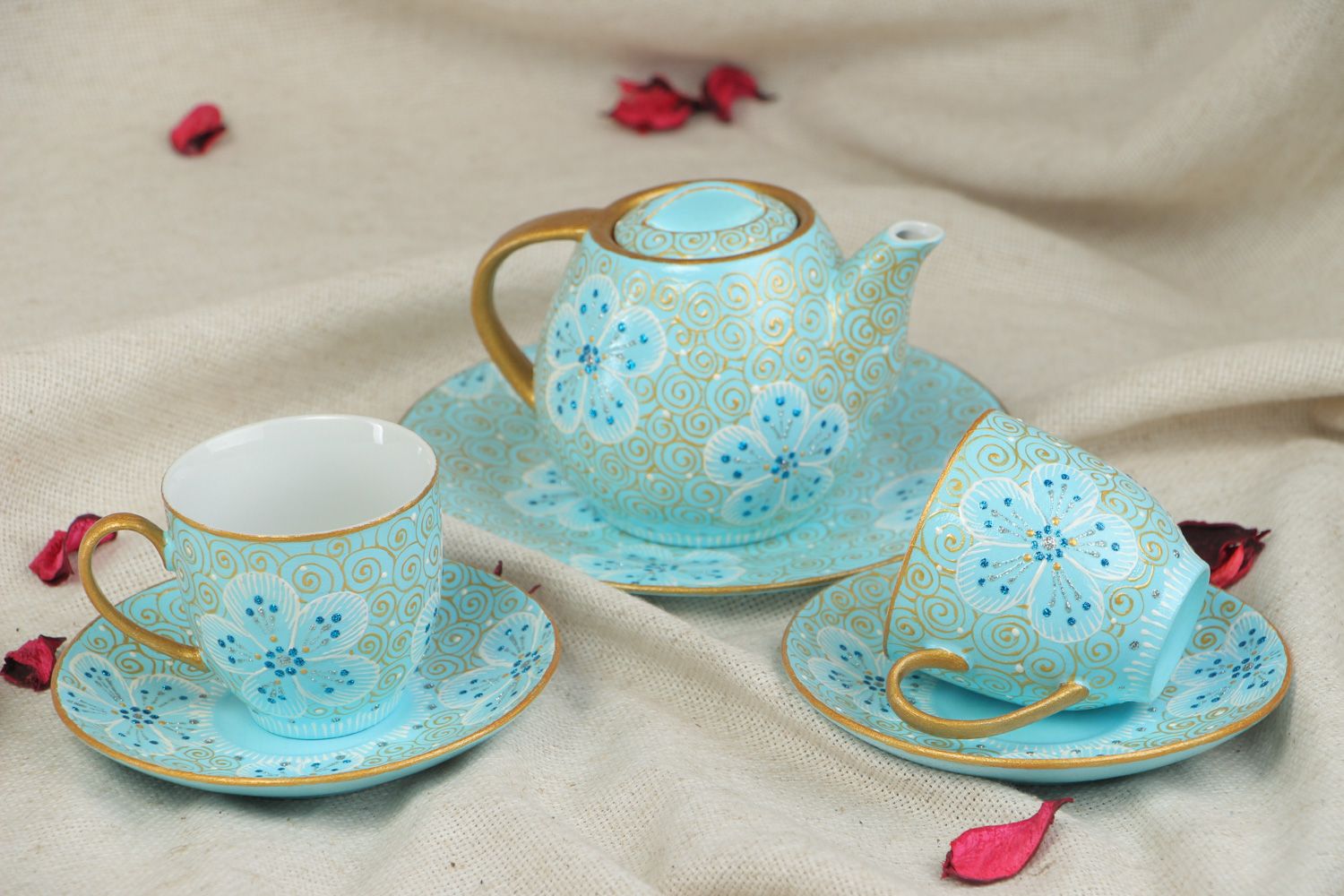 Hand-painted ceramic tea set in blue and gold colors teapot and two cups with handles and saucers photo 5
