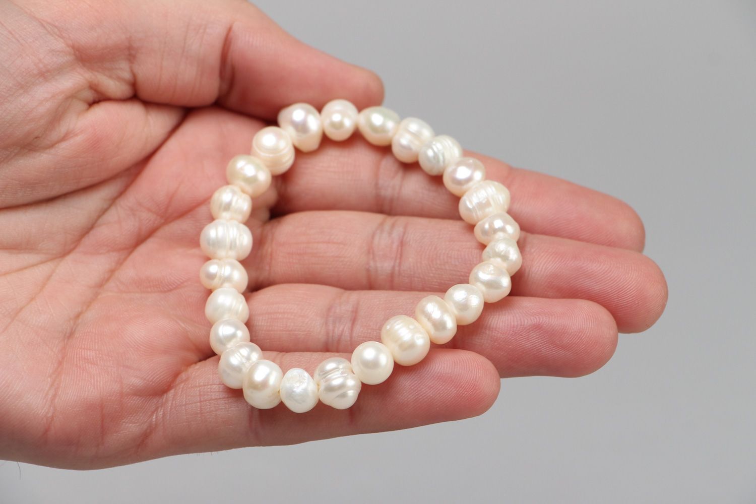 Stylish handmade stretch wrist bracelet with white fresh water pearls for women photo 3