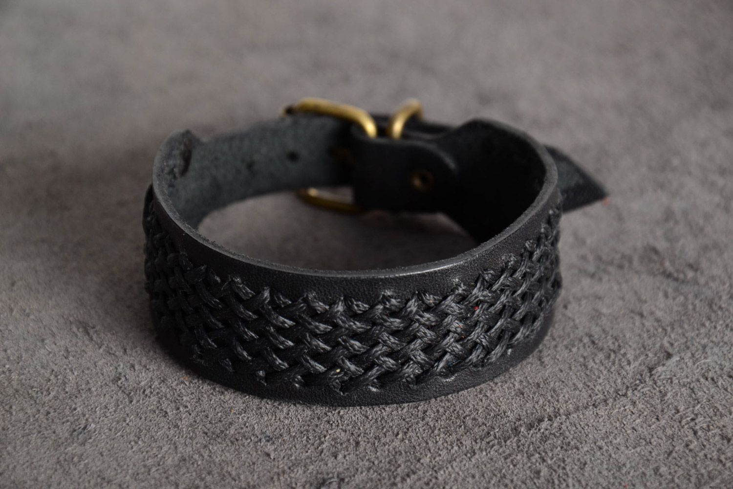 Handmade black genuine leather wrist bracelet with synthetic cord and buckle  photo 1