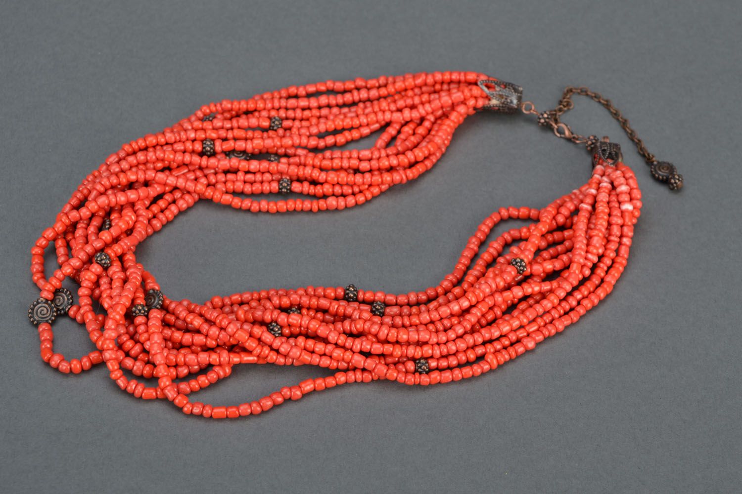 Beaded necklace of coral color photo 3