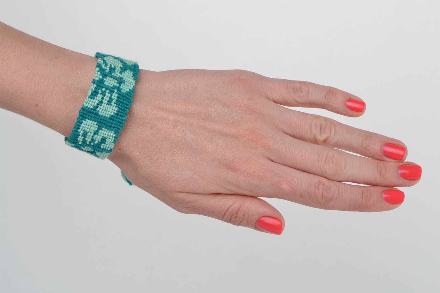 Handmade designer macrame woven wrist bracelet of turquoise color for women photo 2