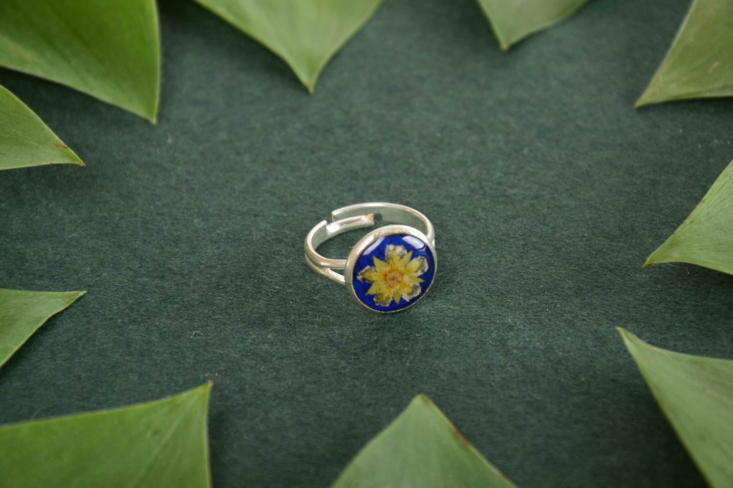 Small elegant handmade round ring with natural flower in epoxy resin photo 1
