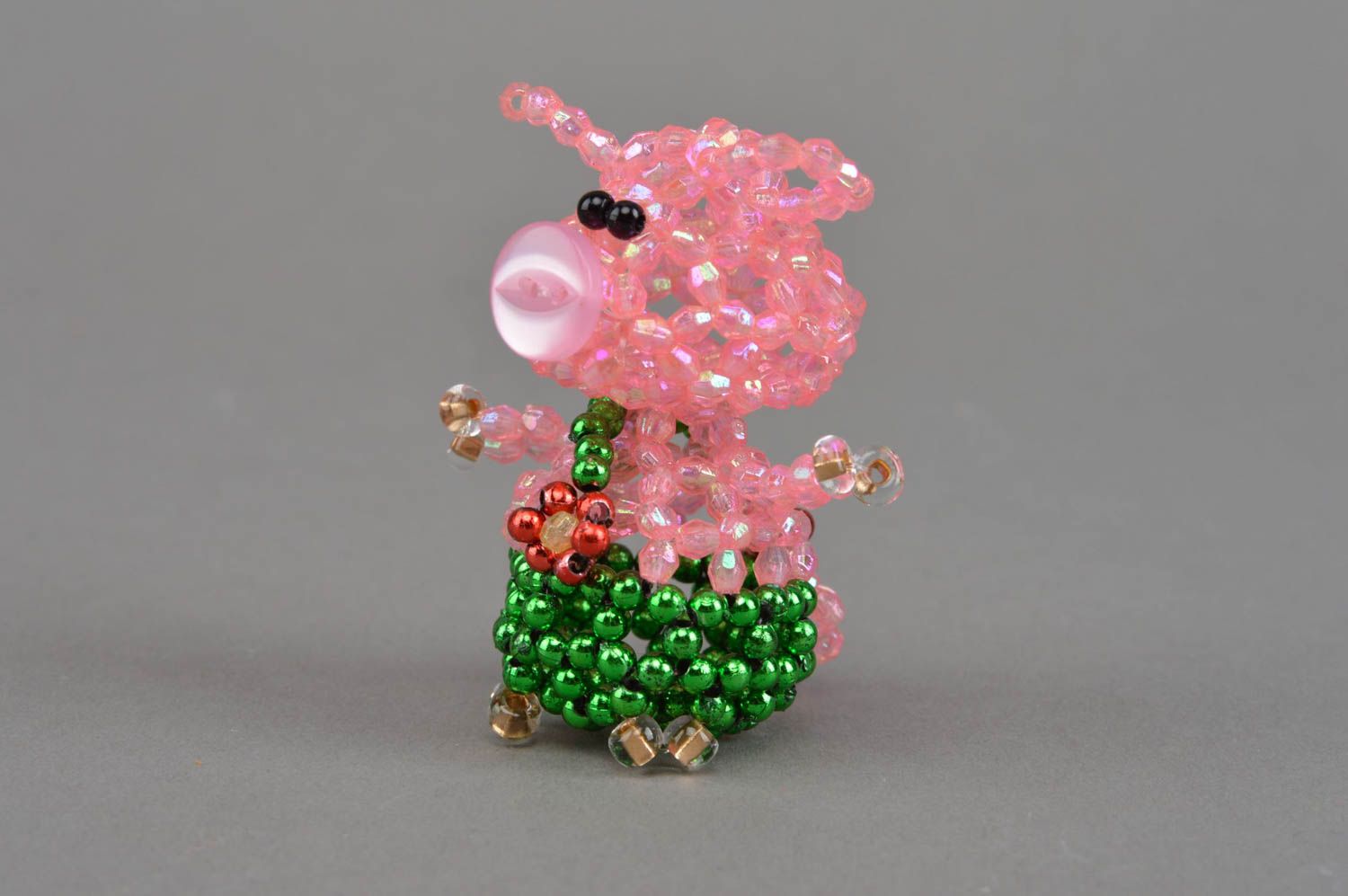 Small handmade designer pink beaded figurine of pig in green pants home decor photo 2