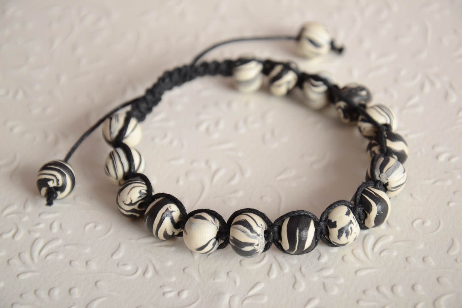 Black and white color beaded bracelet on black cord unisex bracelet photo 1