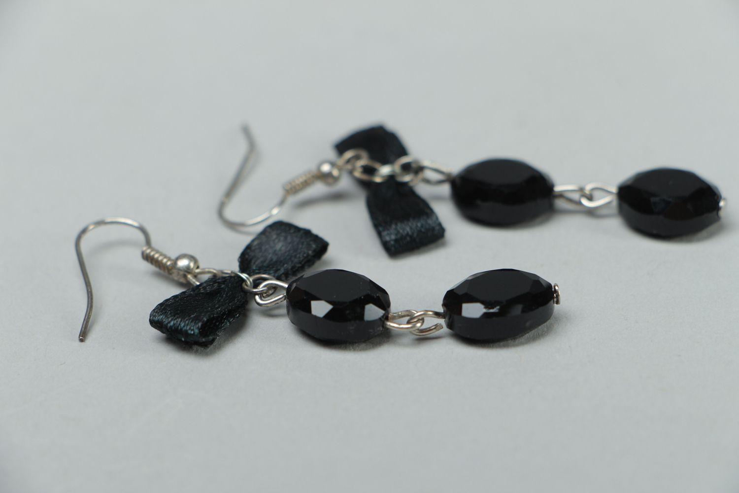 Black earrings with beads and bows photo 2
