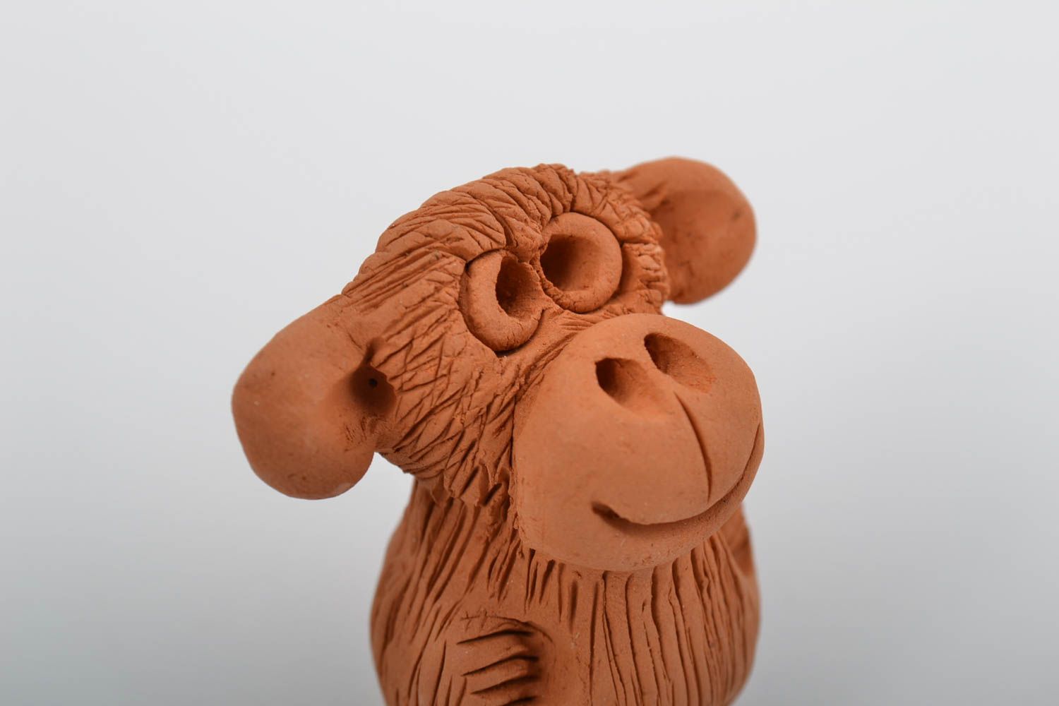 Small brown handmade designer molded red clay statuette of monkey photo 3