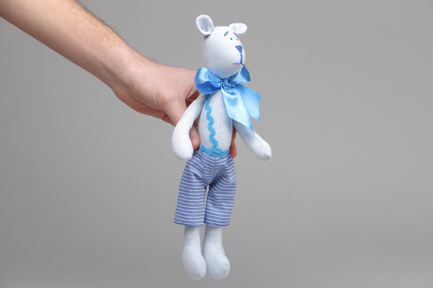 Textile toy bear with bow on the neck photo 4