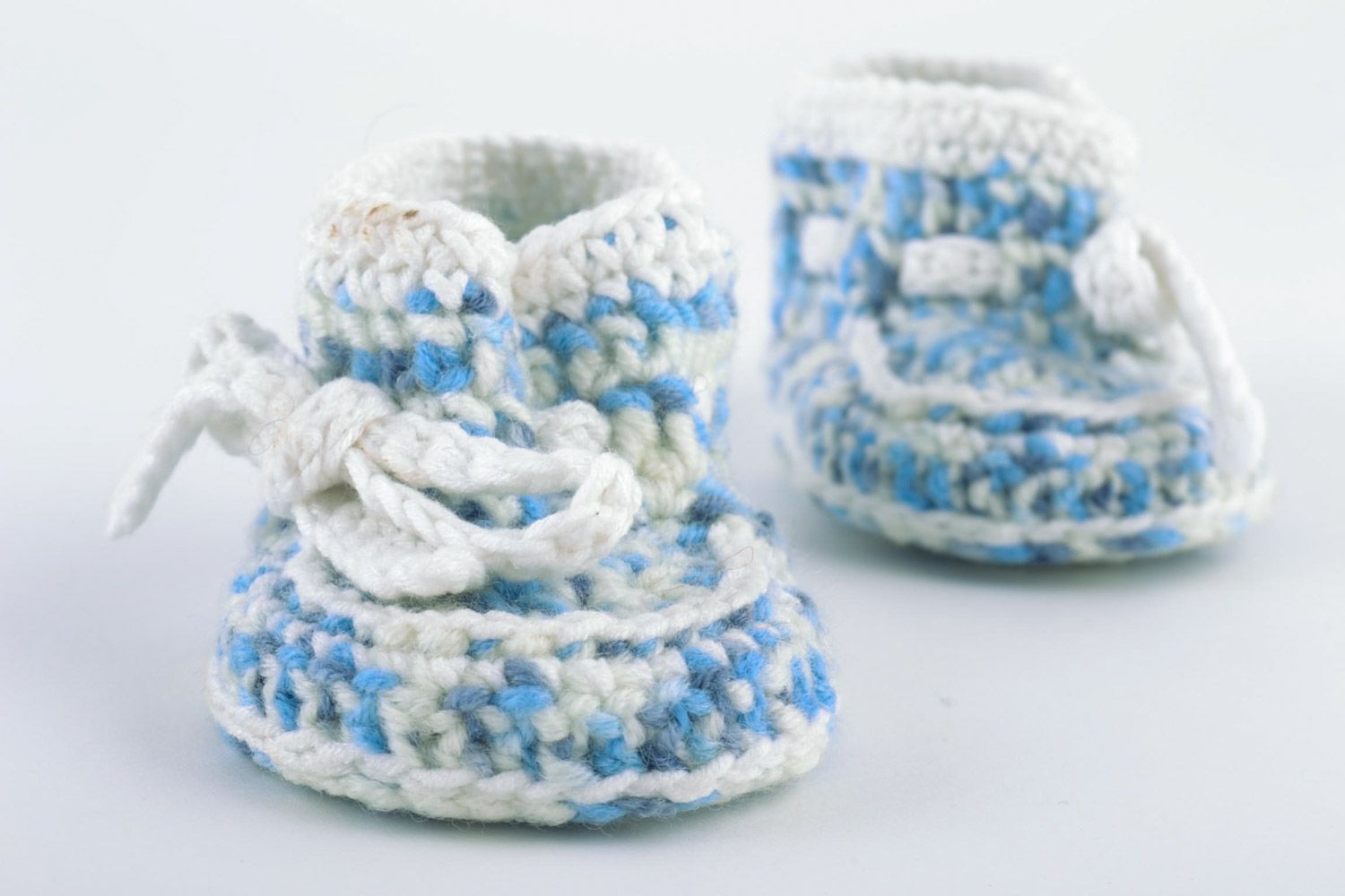 Beautiful handmade knitted woolen baby booties of blue and white colors photo 5