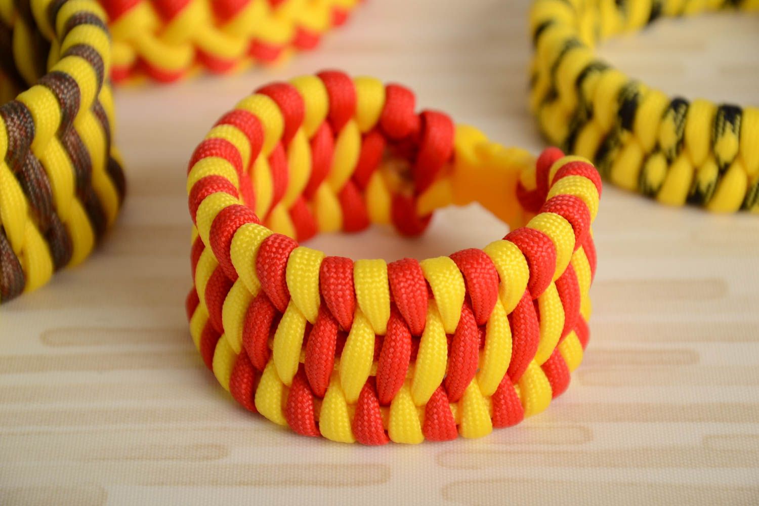 Handmade wide survival wrist bracelet woven of yellow and red paracords unisex photo 1