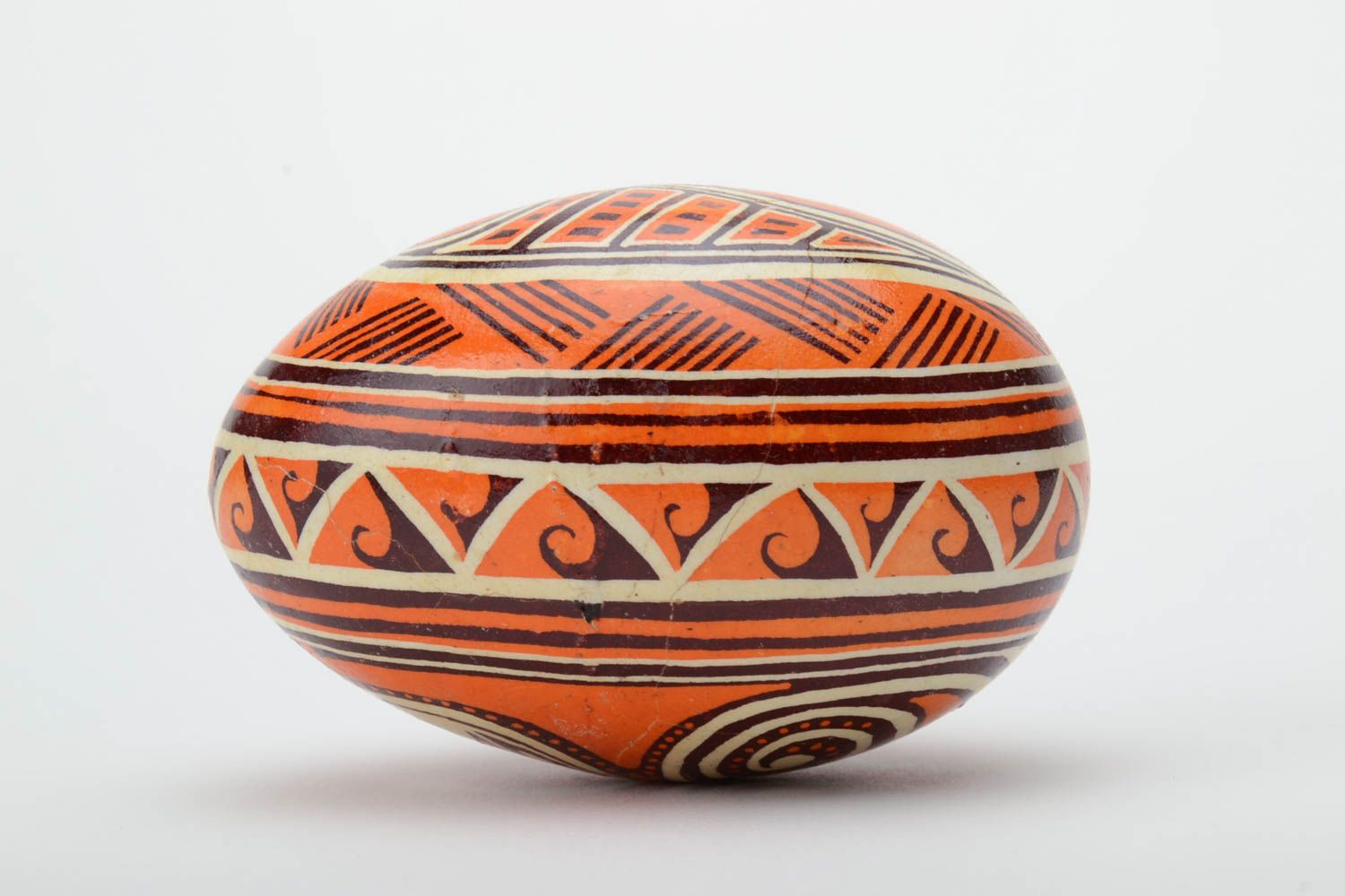 Unusual handmade orange painted Easter egg decorated using waxing technique photo 3