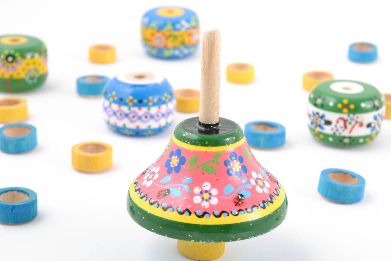Bright painted small handmade children's wooden spinning top photo 1