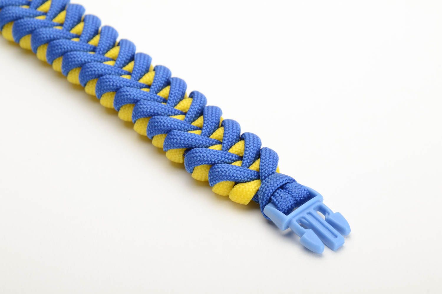 Handmade braided bracelet made of parachute cord blue and yellow unisex accessory photo 2