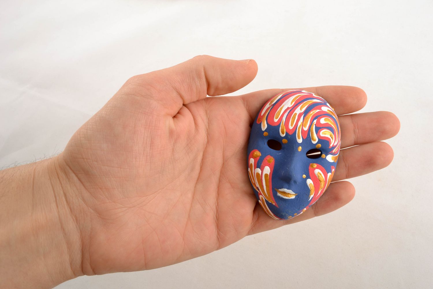 Clay fridge magnet in the shape of mask photo 1