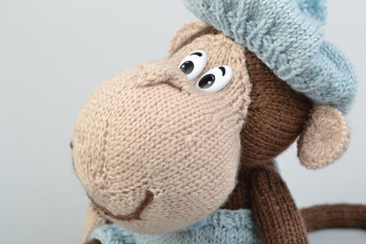 Handmade soft knitted toy monkey in a blue beret for children photo 3