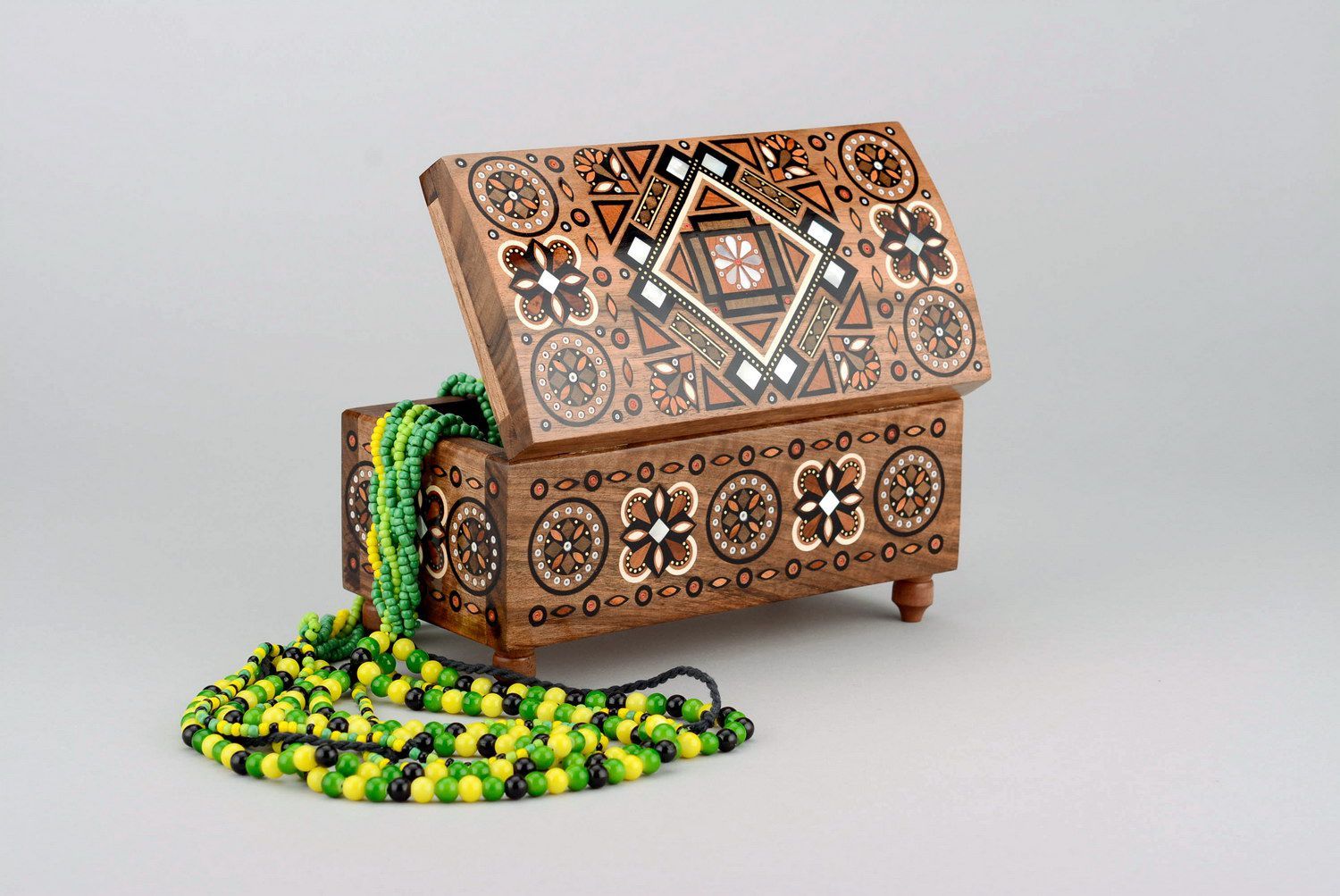 Wooden box inlaid with wood pieces photo 1
