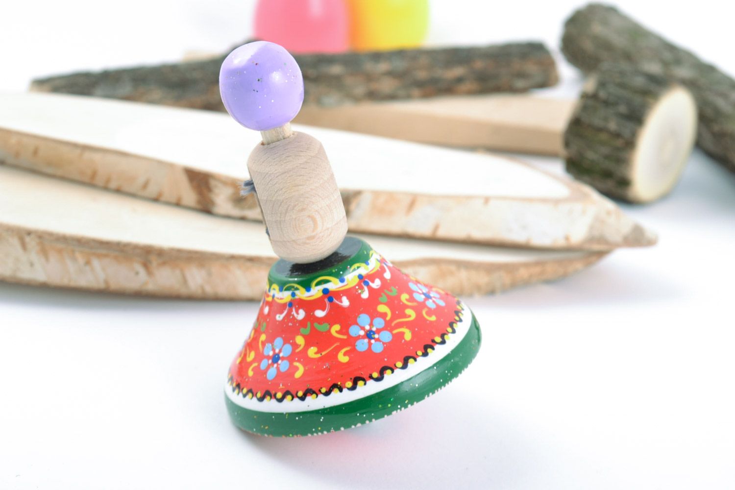 Wooden handmade spinning top decorated with eco-friendly paints  motor development photo 1
