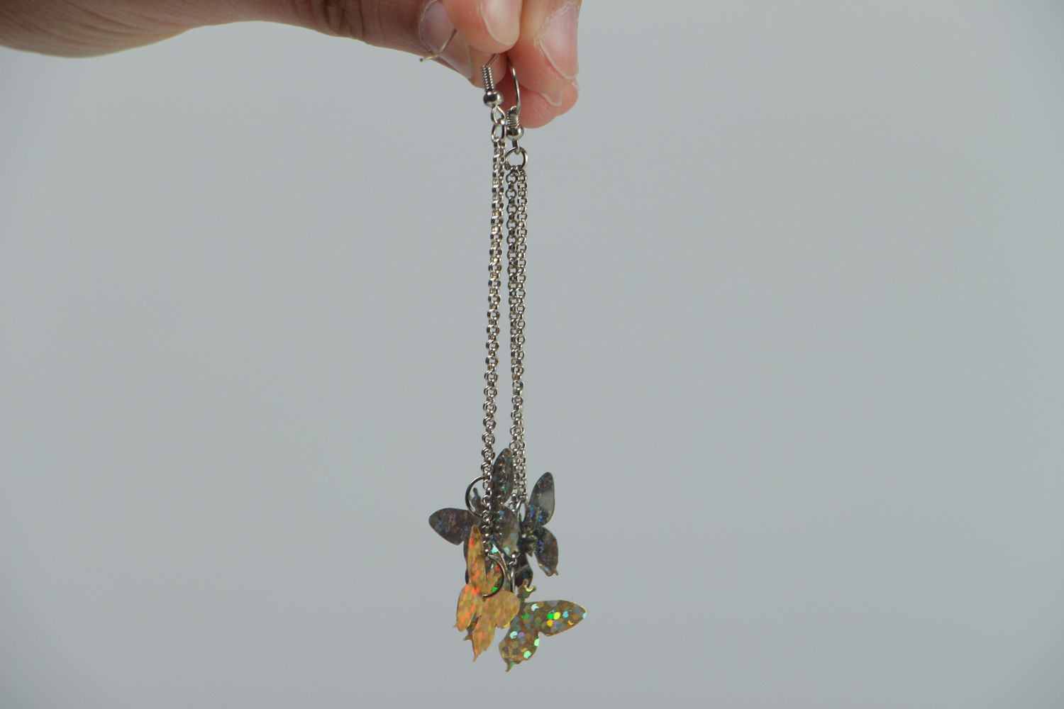 Metal earrings with charms in the shape of butterflies photo 3