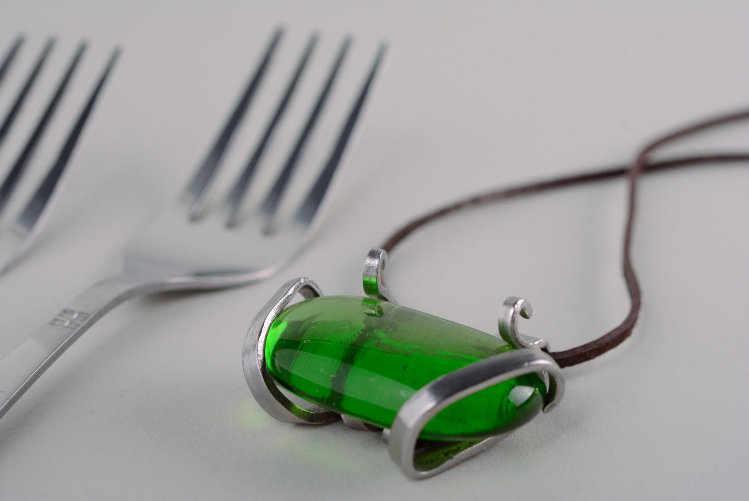 Homemade metal pendant made of cupronickel fork with green artificial stone photo 1