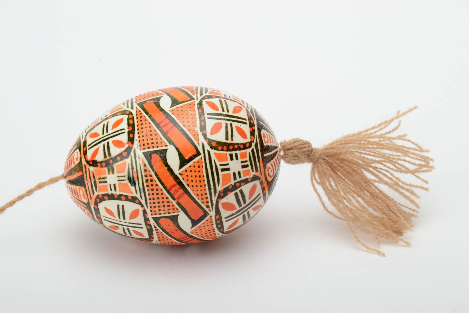 Handmade decorative Easter egg painted in brown color palette with beige tassel photo 3