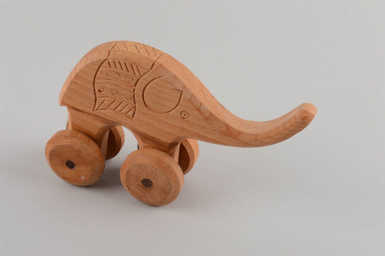 Handmade children's wooden wheeled toy elephant educational photo 2