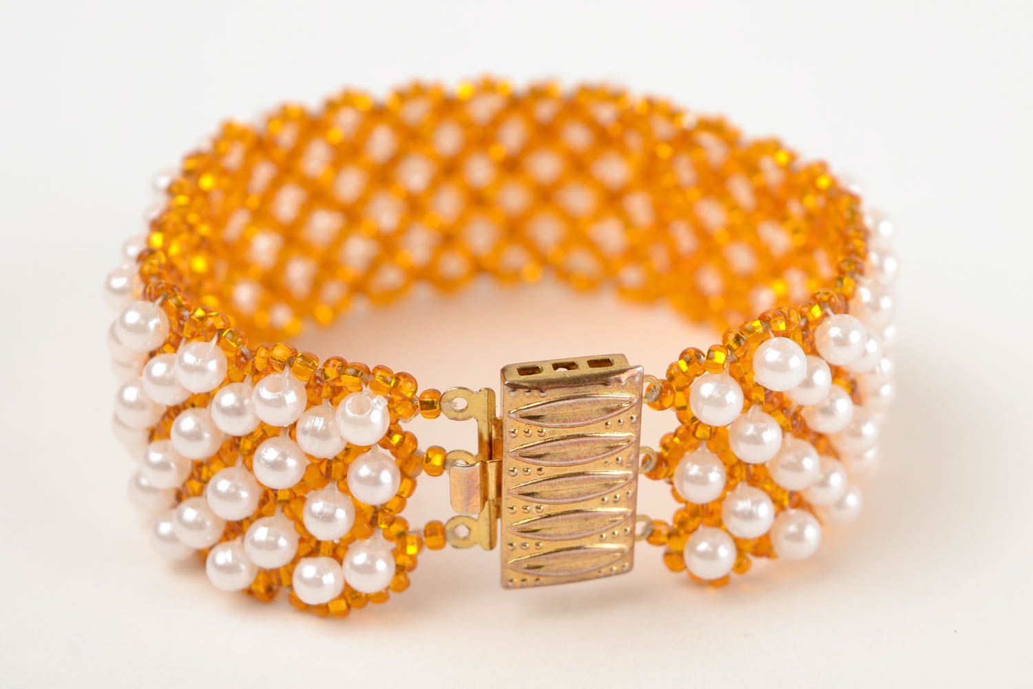 Handmade beaded wide bracelet in golden and white colors photo 5