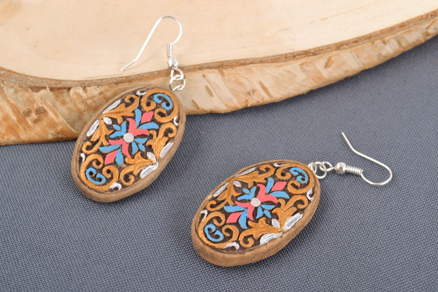 Homemade oval ceramic dangling earrings with ornament painted with acrylics photo 1