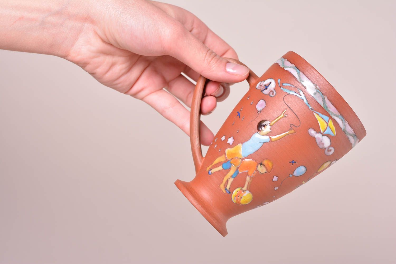 Tall red clay glazed 5 oz cup with boys' pattern and a handle photo 2