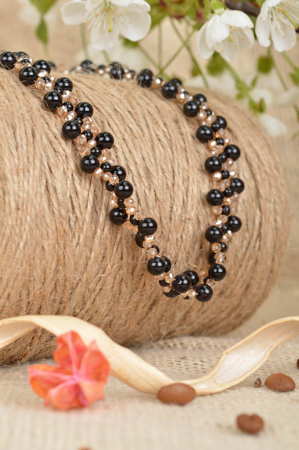 Black and gold handmade necklace made of ceramic beads and rock crystal photo 1