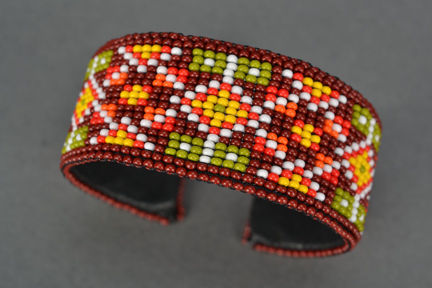 Cuff beaded bracelet in orange dark red and yellow colors photo 1