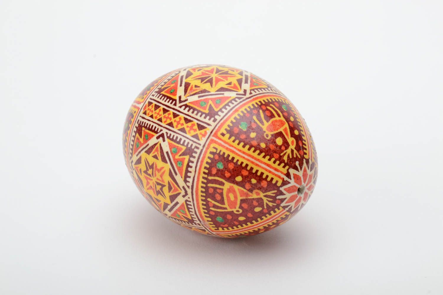 Homemade decorative souvenir Easter egg painted with hot wax and aniline dyes photo 4