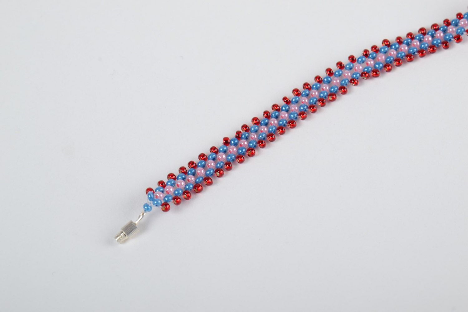 Girls' beaded bracelet made of Czech beads of red, pink, and dark blue color photo 3