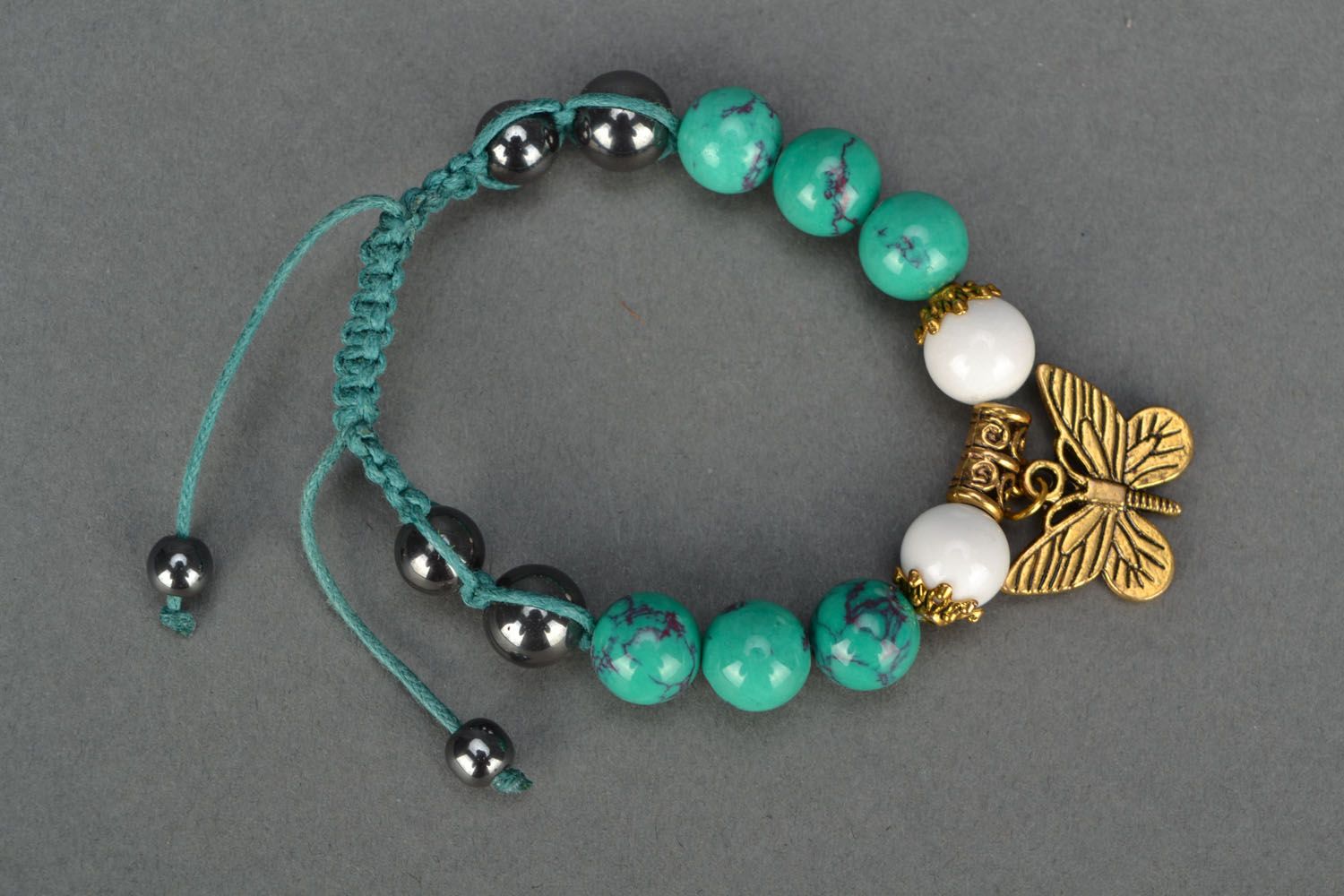 Beaded bracelet with metal charms photo 2