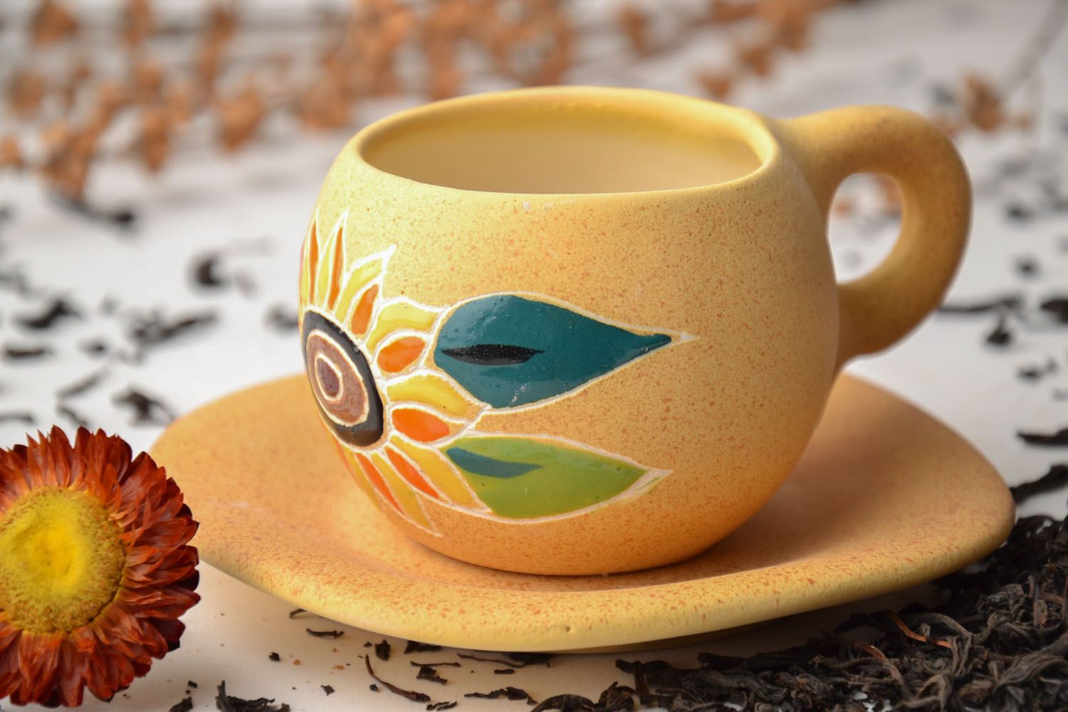 Art clay glazed teacup in yellow color with floral pattern, handle, and saucer photo 1