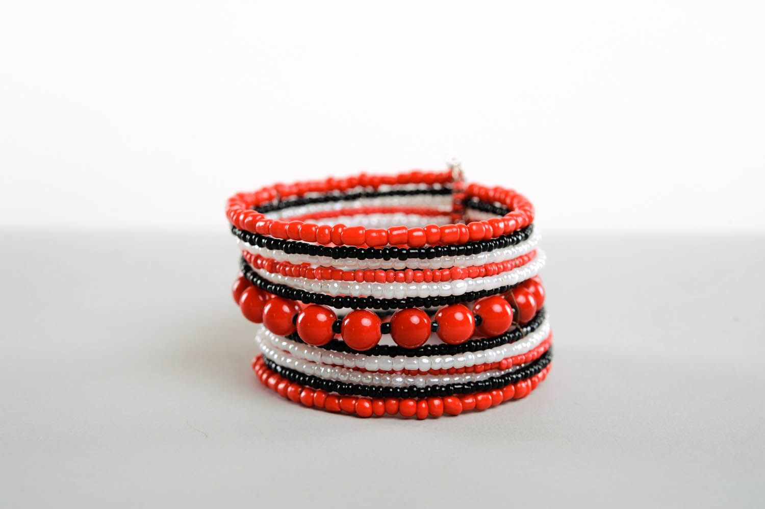 Wide handmade ethnic beaded bracelet with multiple rows with coral stones for women photo 3